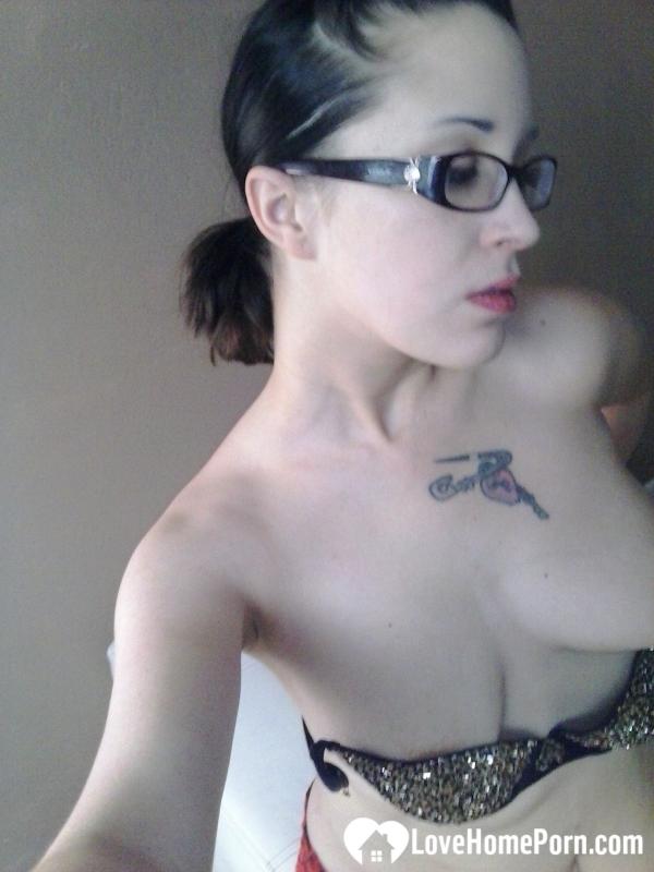 Nerdy girl sensually fingers her wet snatch